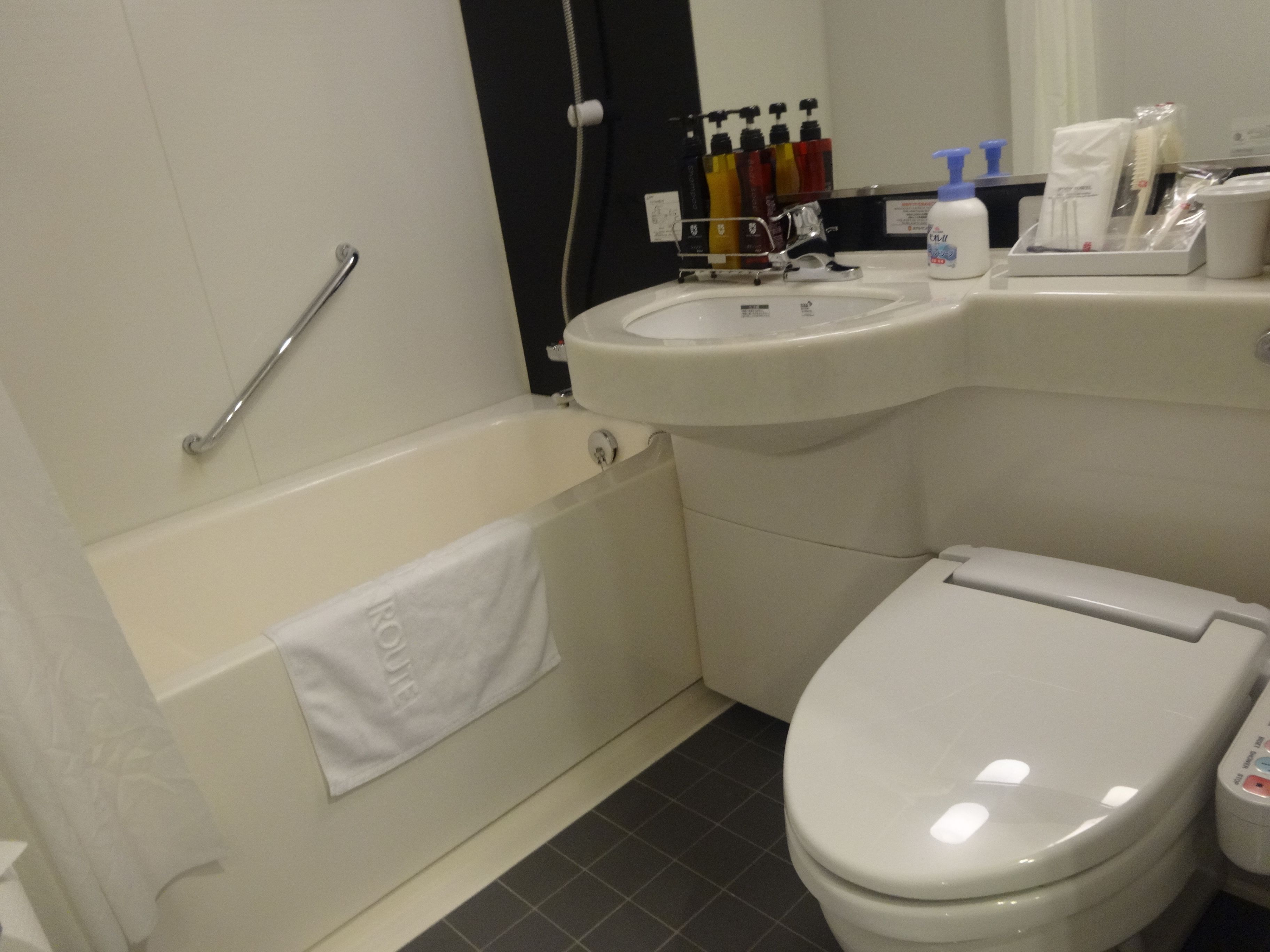 combined shower/bathtub, free toiletries, hair dryer, slippers