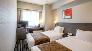 A hotel room with two beds, a desk with a television, a window with curtains, and a painting on the wall.