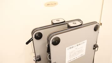 A suitcase with a label indicating it is for use by guests.