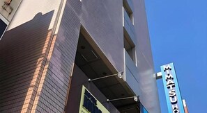 A building with a prominent sign that reads 'MATSU'. - Mimatsu Hotel (Mito)