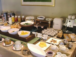 A buffet setup with various food items and beverages. - Mimatsu Hotel (Mito)