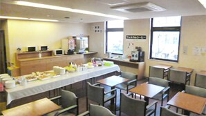 A cafeteria with long tables, chairs, and a variety of food items on display. - Smile Hotel Otsu Seta (Otsu)