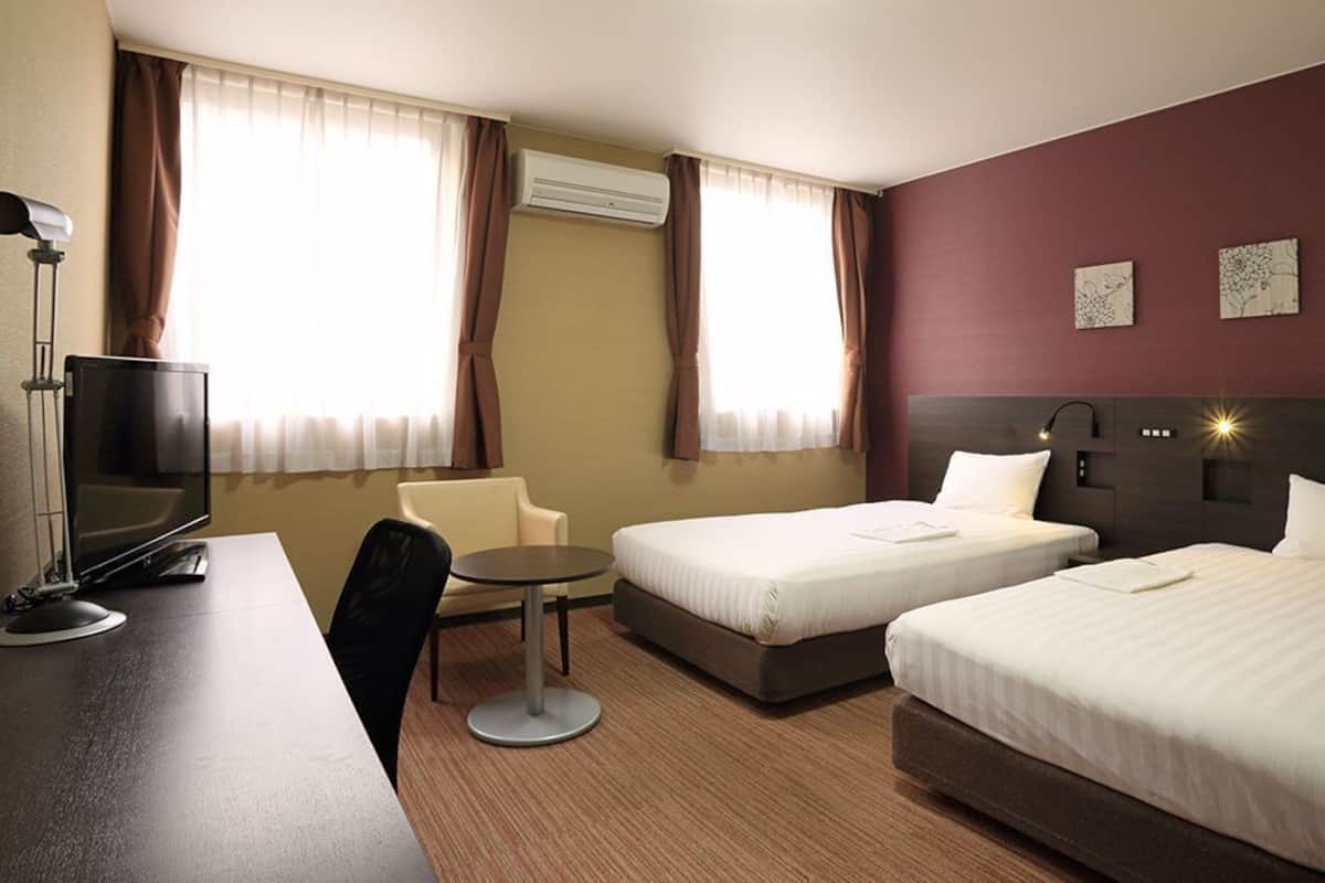 Desk, laptop workspace, blackout curtains, free WiFi