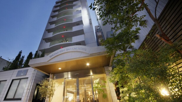 A hotel with a modern facade, multiple balconies, and a well-lit entrance. - Shonandai Dai-Ichi Hotel Fujisawa Yokohama (Fujisawa)