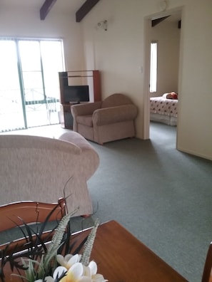 Apartment, 1 Bedroom | Living area | Flat-screen TV