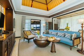 1BR Ocean View Villa | Living area | 55-inch LED TV with satellite channels, TV, toys - AYANA Villas Bali (Jimbaran)