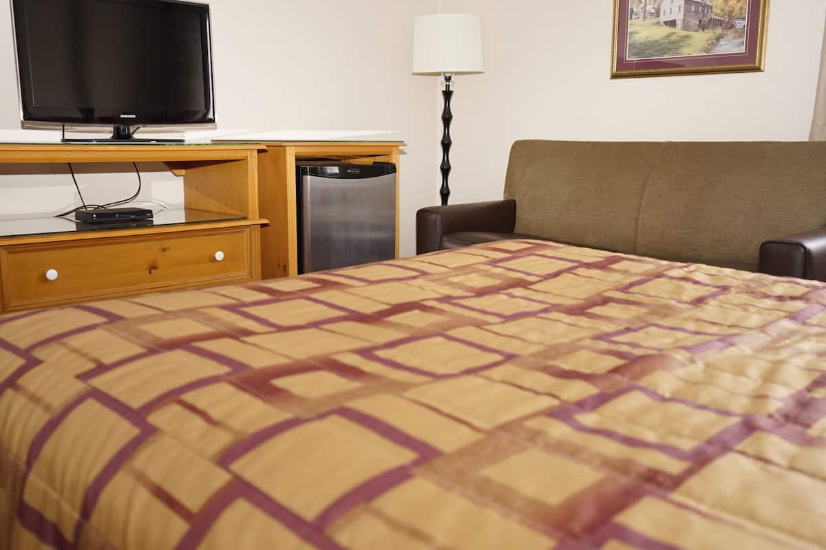 Deluxe kamer, 1 queensize bed | Een strijkplank/strijkijzer, beddengoed