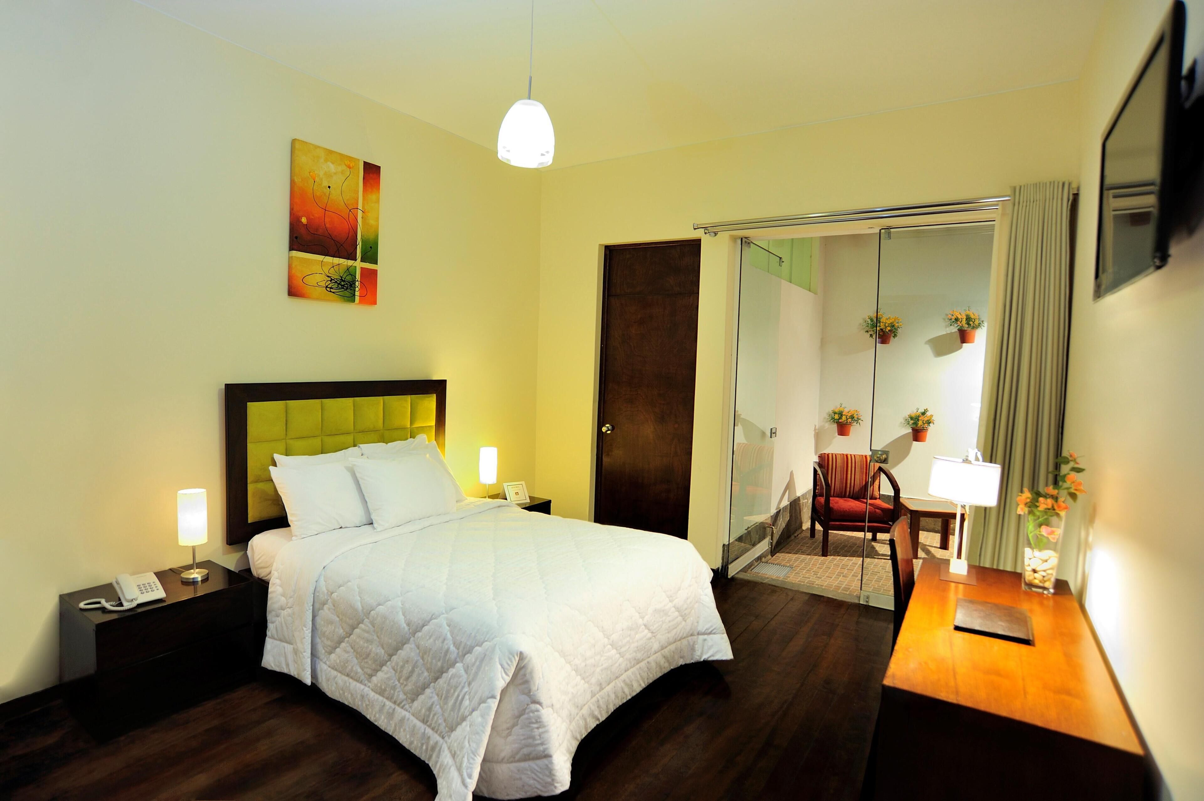 Premium bedding, down comforters, minibar, in-room safe