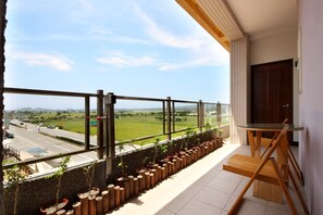 Habitación cuádruple Elite, 2 camas dobles | Balcón