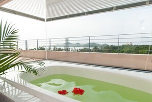 Junior Suite, Non Smoking | Bathroom | Hair dryer, slippers