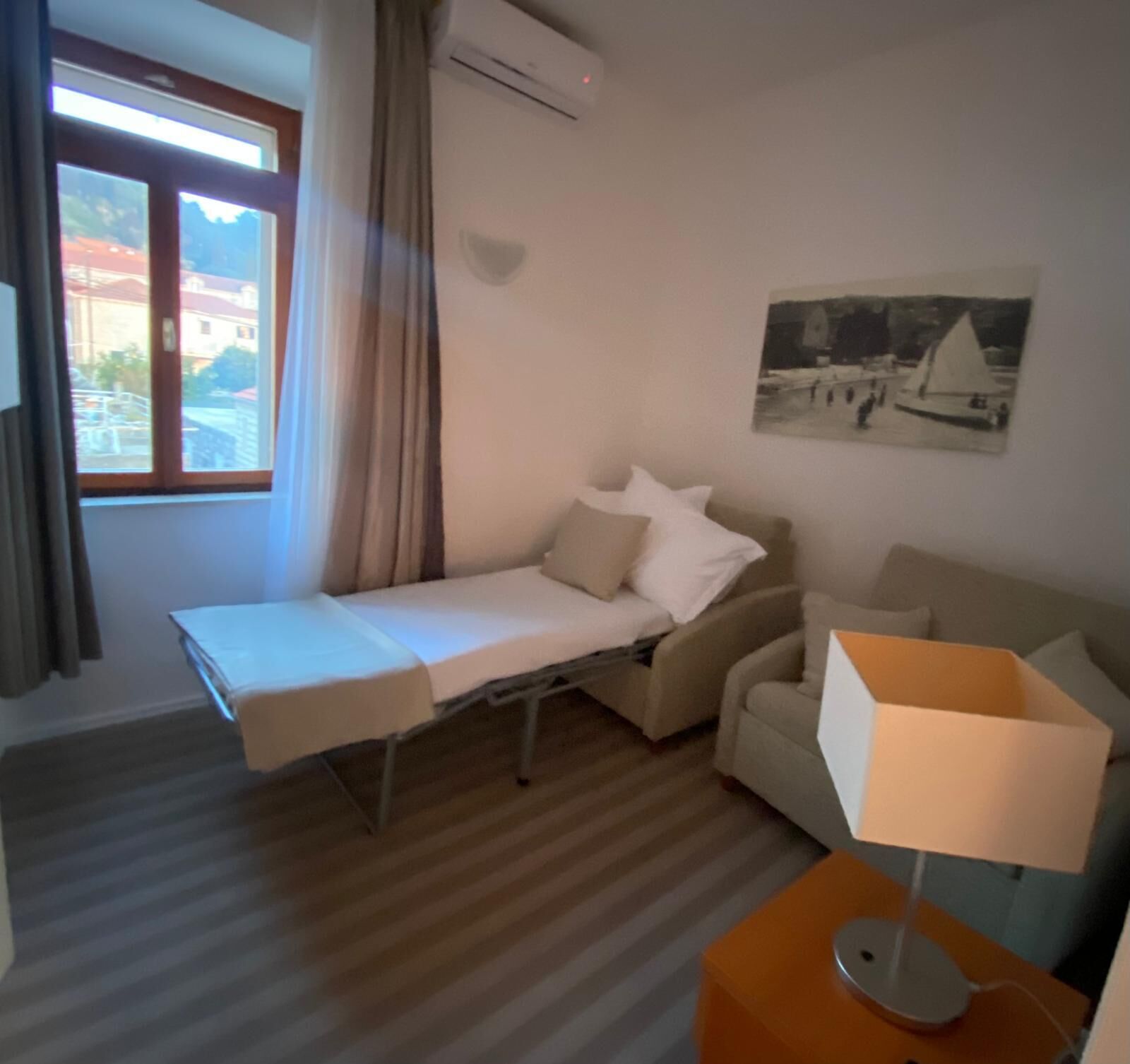 family room, 2 bedrooms, sea view | in-room safe, desk, iron/ironing board, free wifi