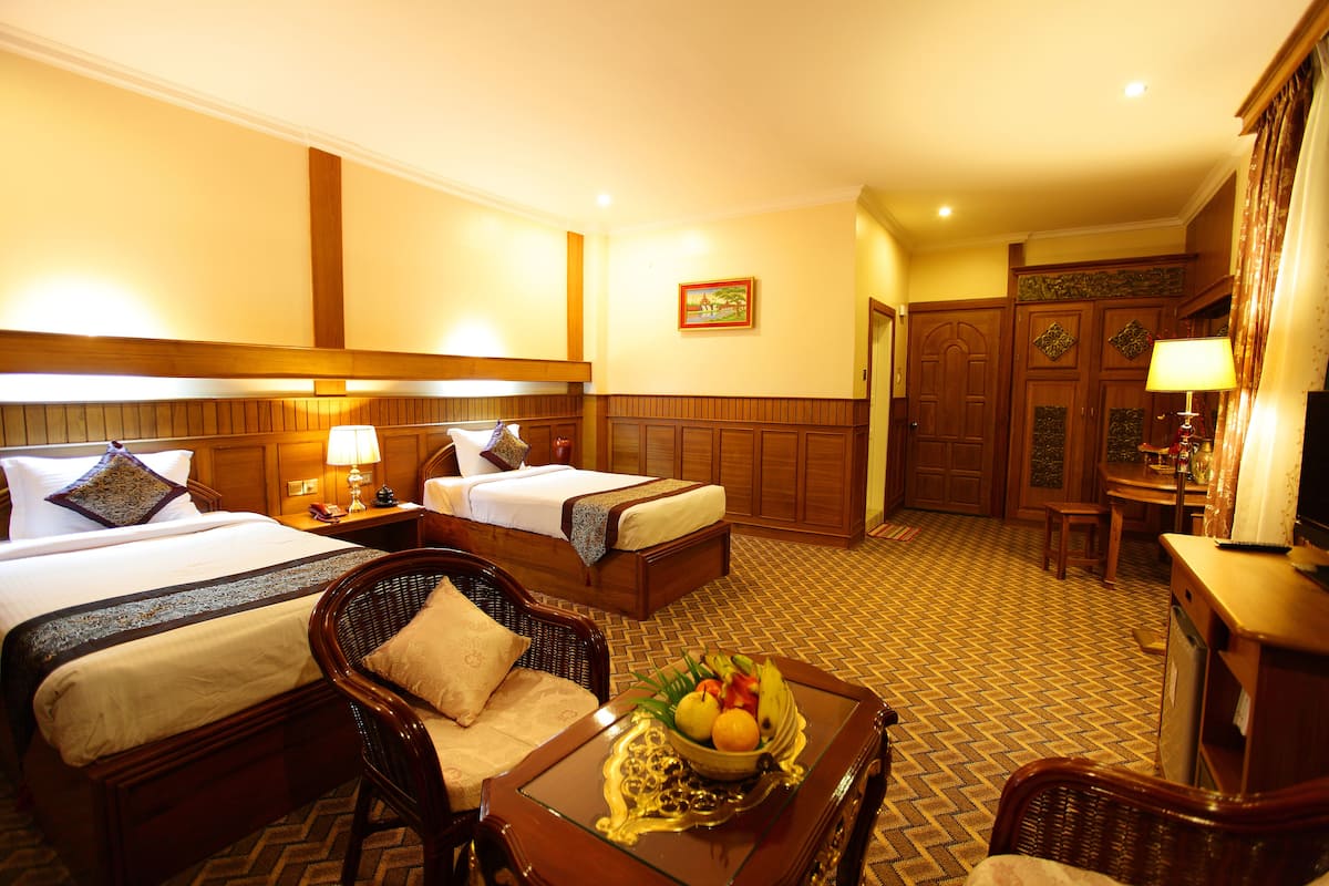Deluxe Room, River View | Free minibar items, in-room safe, desk, blackout drapes