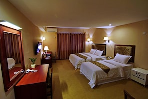 Family Room | Minibar, in-room safe, desk, blackout drapes - M3 Hotel (Mandalay)
