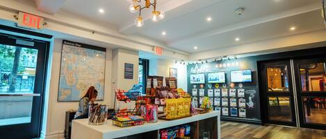 A modern interior with a map on the wall, an exit sign, and a variety of products on display.
