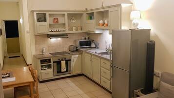 Comfort Double Room, 2 Bedrooms, Partial Ocean View, Beachside | Private kitchen | Full-sized fridge, microwave, stovetop, coffee/tea maker