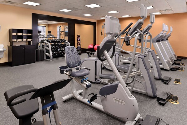 A gym with various exercise equipment including treadmills, elliptical machines, and free weights. - Homewood Suites Houma, La (Houma)