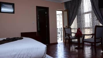 Family Suite, 2 Bedrooms | Living area | 32-inch flat-screen TV with satellite channels, TV