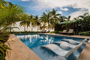 Outdoor pool, open 9:00 AM to 6:00 PM, pool umbrellas, sun loungers - Coconut Row Boutique Hotel (Hopkins)