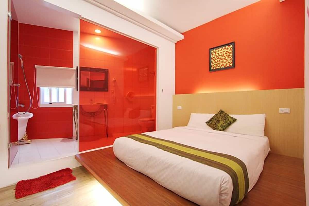 Habitación doble Elite | Área de sala de estar | Televisión LCD