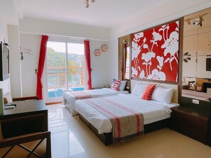 A hotel room with two beds, a balcony, and a large decorative wall. - Warner Leisure Hotel (Hengchun)