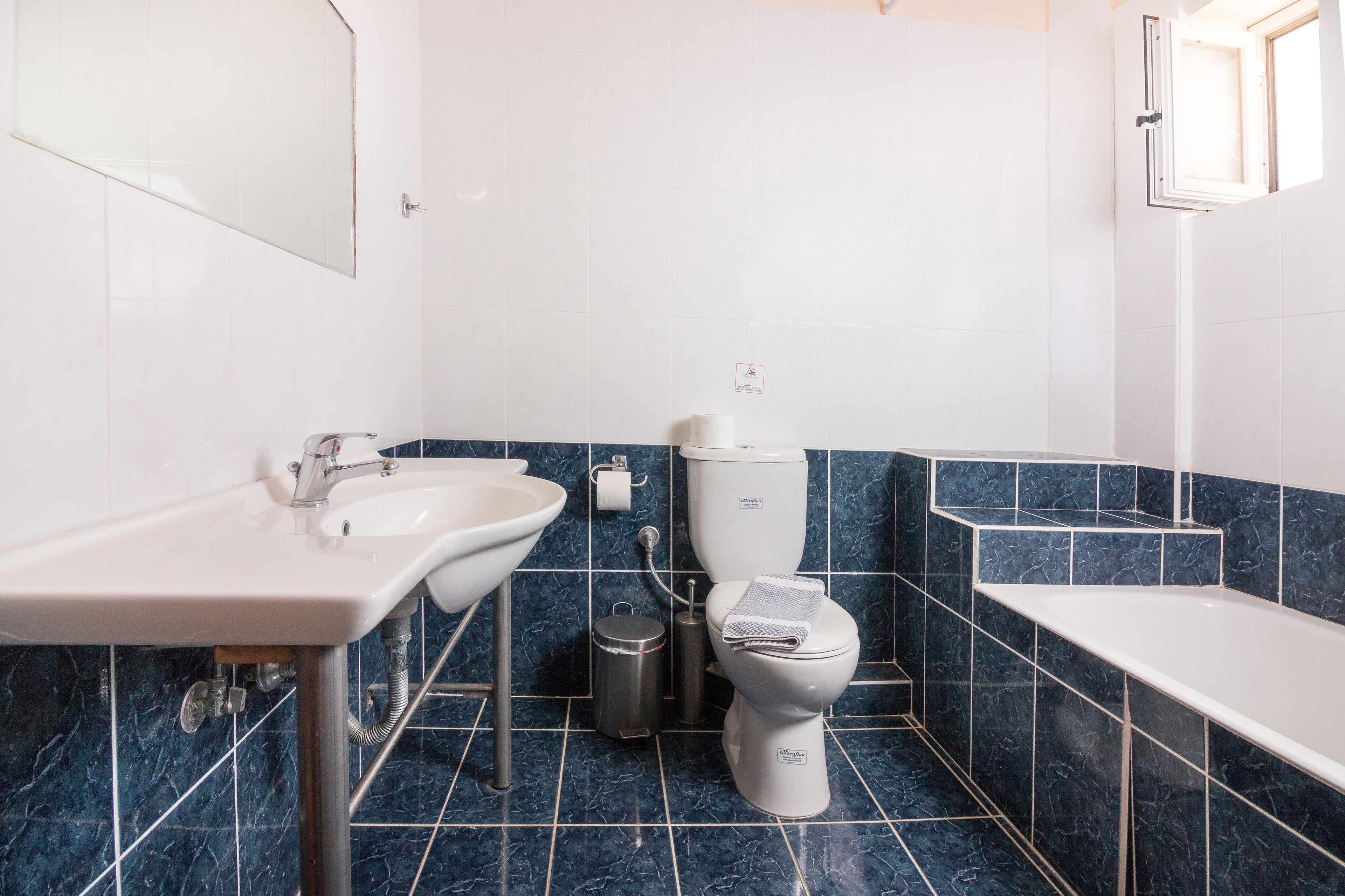 shower, rainfall showerhead, hair dryer, towels