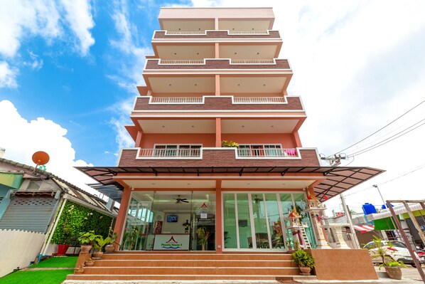 A multi-story building with a glass entrance and a sign reading "Phu Thai House 3". - Phusita House 3 (Patong)