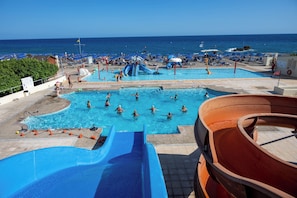 2 outdoor pools, pool umbrellas, sun loungers