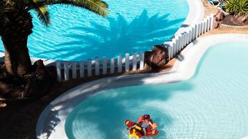 Indoor pool, outdoor pool, pool umbrellas, pool loungers