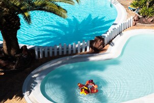 Indoor pool, outdoor pool, pool umbrellas, pool loungers