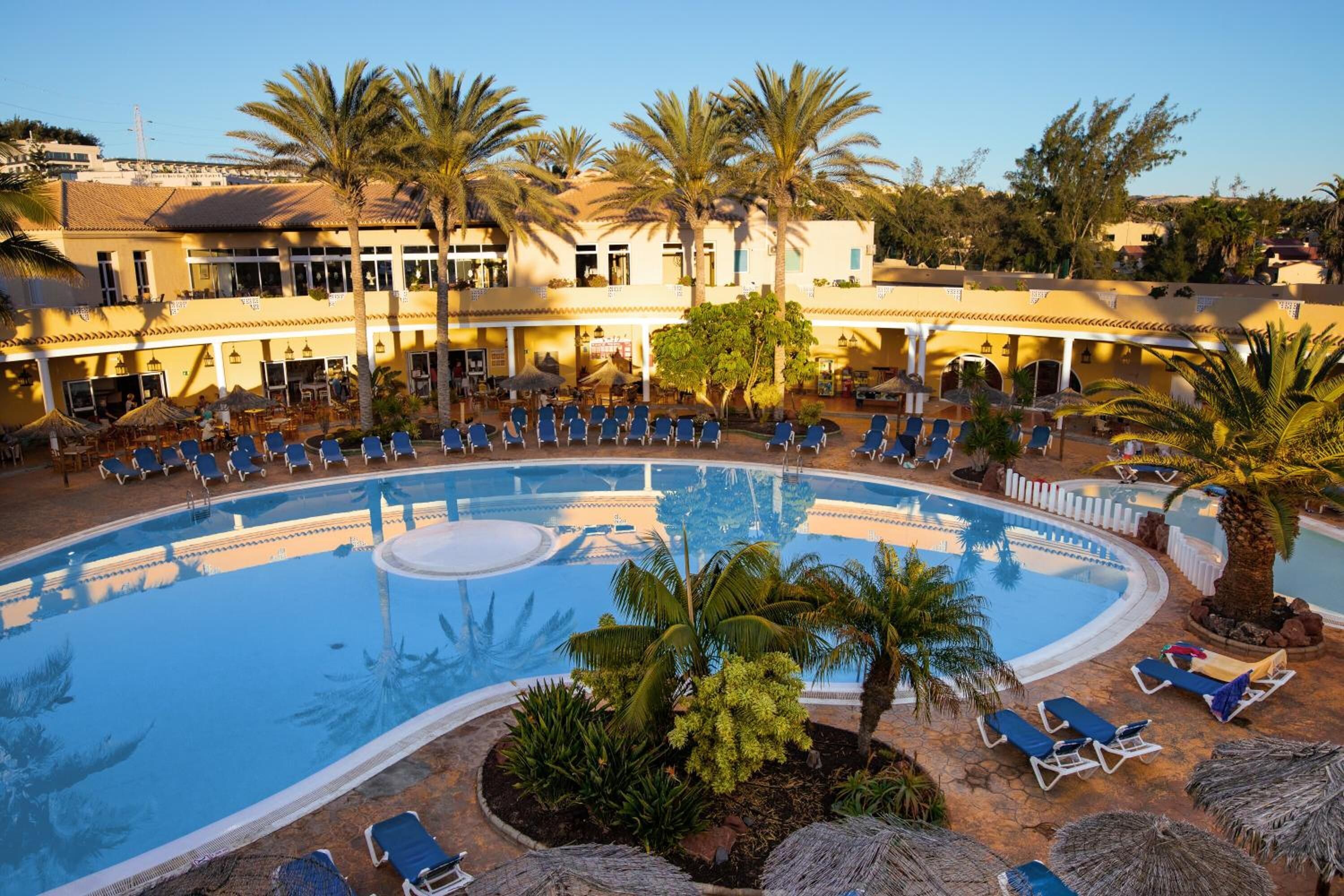 indoor pool, outdoor pool, pool umbrellas, pool loungers