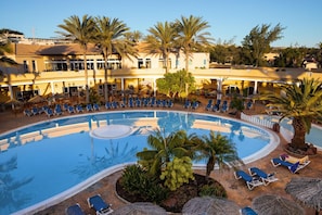Indoor pool, outdoor pool, pool umbrellas, pool loungers