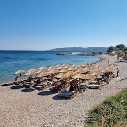 On the beach, sun-loungers, beach umbrellas