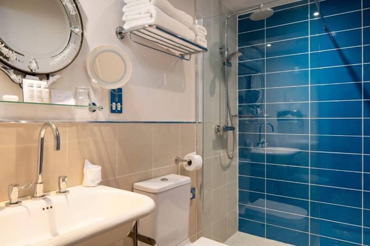 Designer toiletries, hair dryer, bathrobes, towels