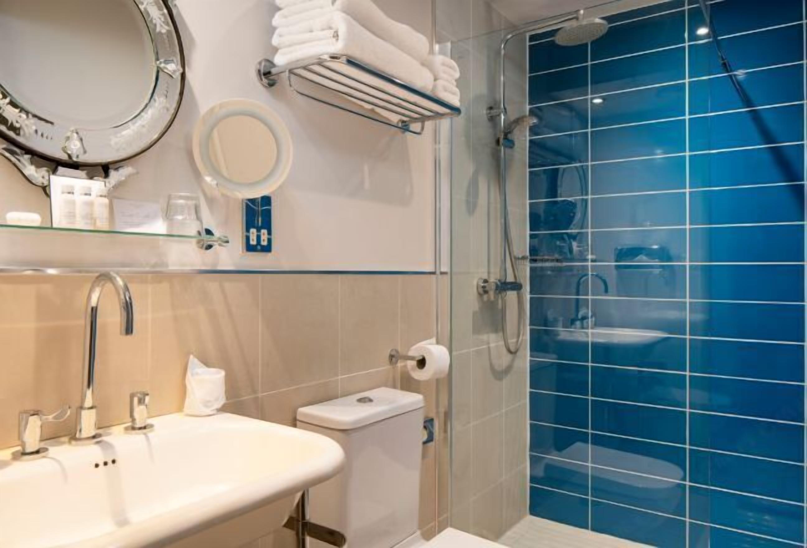 Designer toiletries, hair dryer, bathrobes, towels