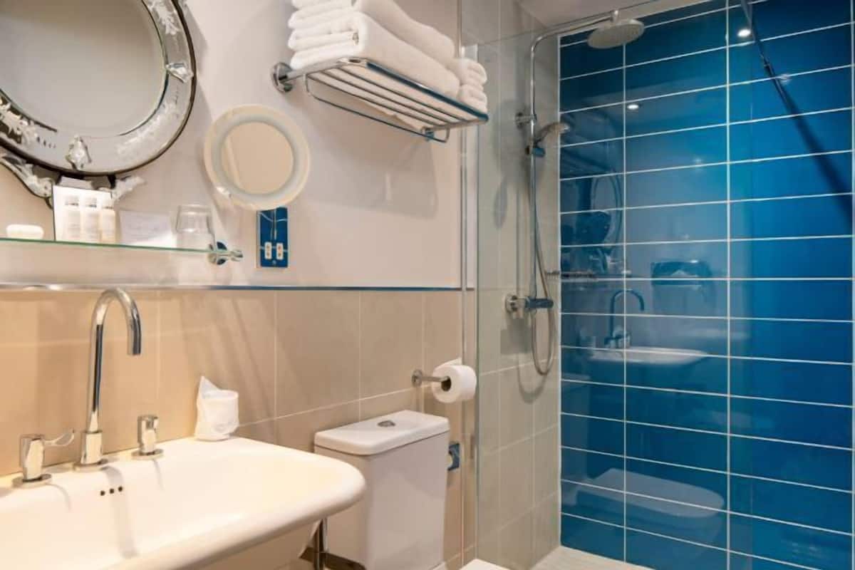Designer toiletries, hair dryer, bathrobes, towels