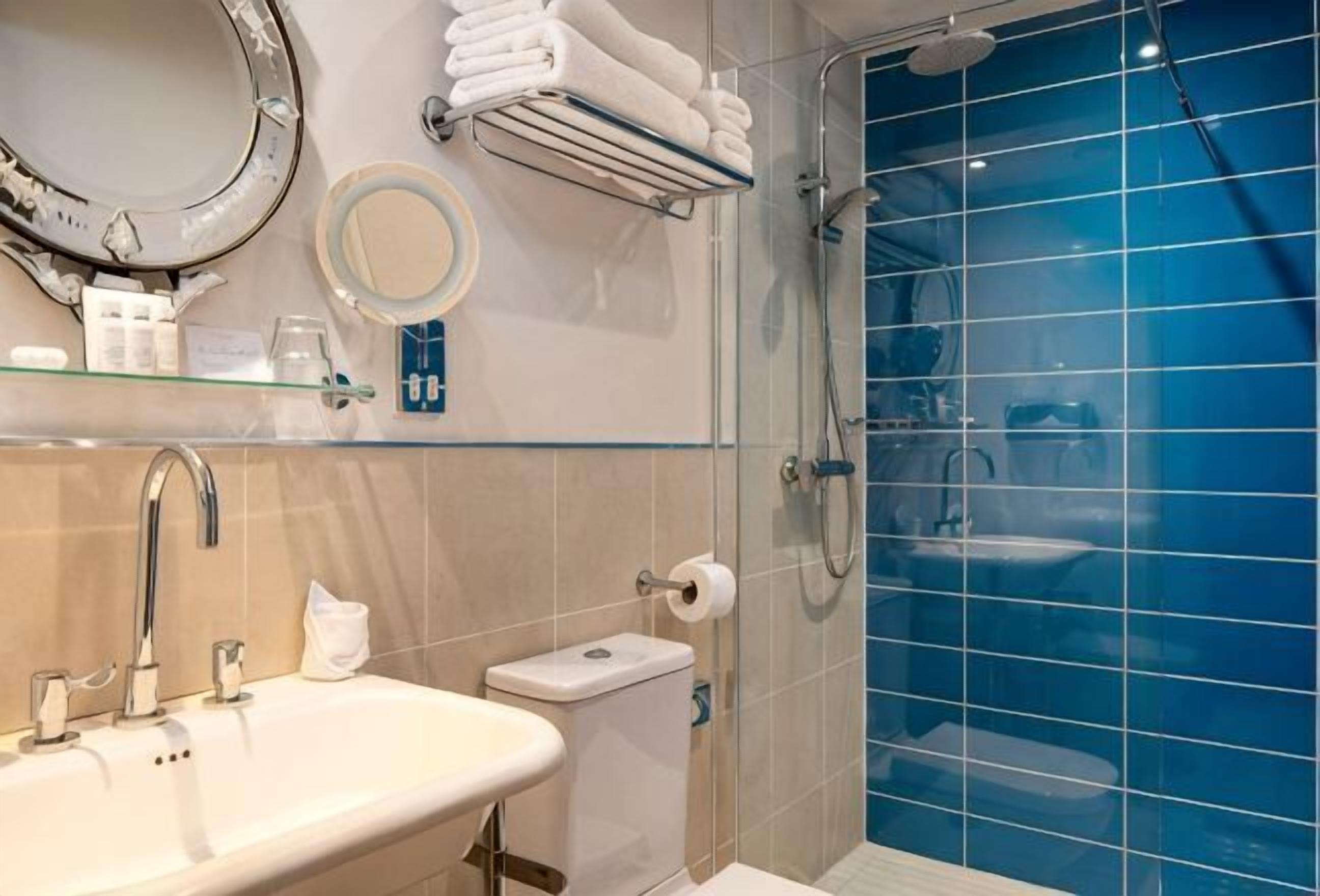 Designer toiletries, hair dryer, bathrobes, towels