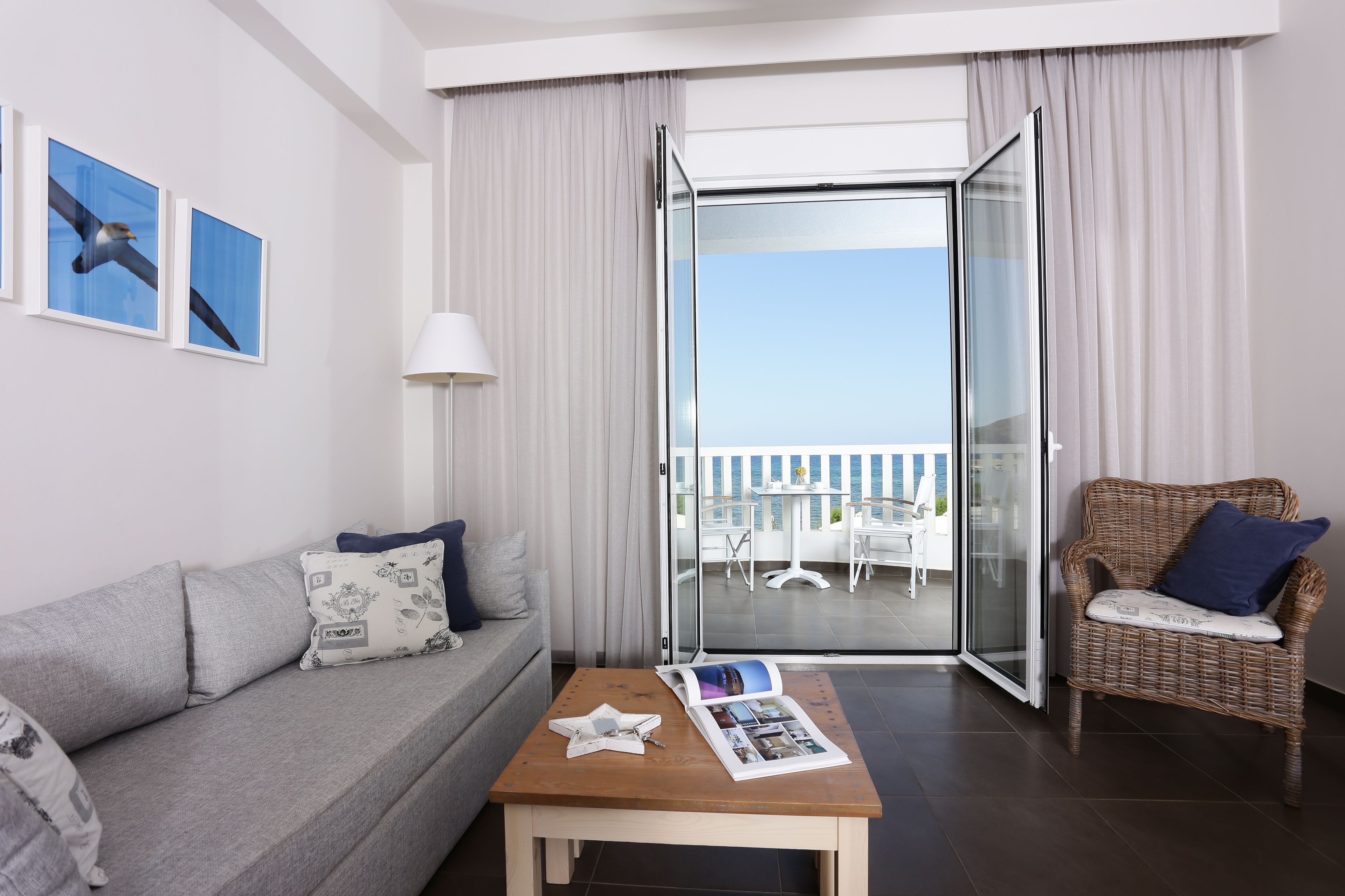 studio, partial sea view | living room | flat-screen tv