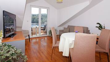 One-Bedroom Apartment Balcony Sea Vew | Living area | Flat-screen TV
