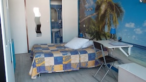 Desk, iron/ironing board (on request), free cots/infant beds - Hotel Arc En Ciel (Royan)
