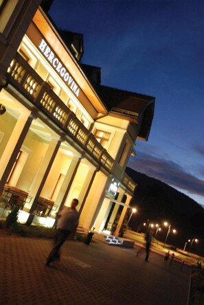A hotel with a prominent sign reading "HERCEGOVINA" at night. - Hotel Hercegovina (Sarajevo)