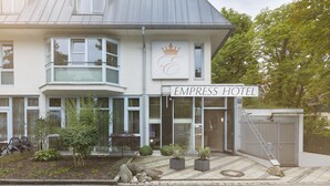 A hotel with a prominent sign reading "EMPRESS HOTEL". - Empress Hotel (Munich)