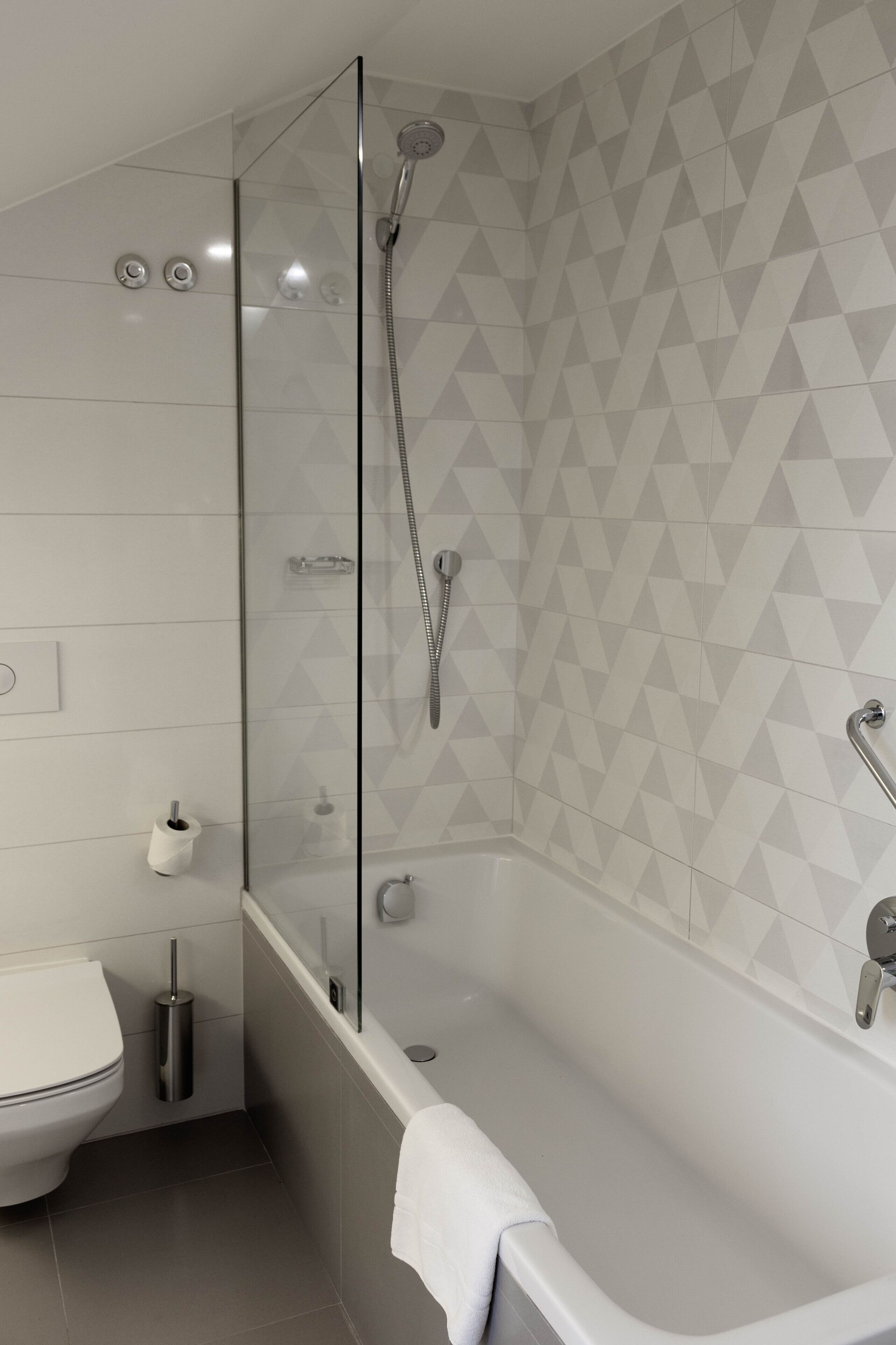 family double or twin room, city view (street view) | bathroom | deep-soaking bathtub, designer toiletries, hair dryer, bathrobes