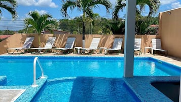 Outdoor pool, open 9 AM to 8 PM, pool umbrellas, sun loungers