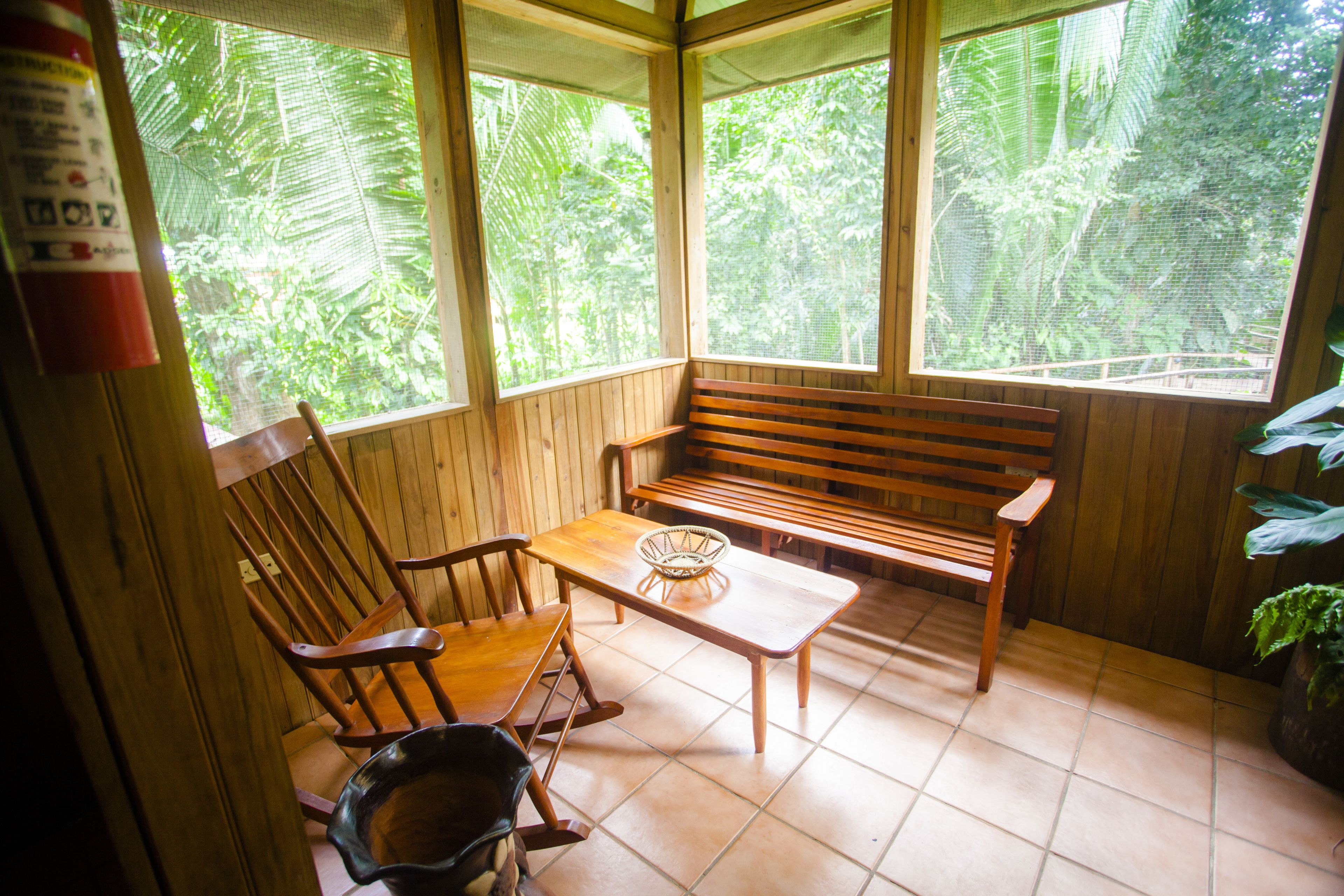 exclusive cabin, 2 bedrooms, garden view, garden area | living area | books