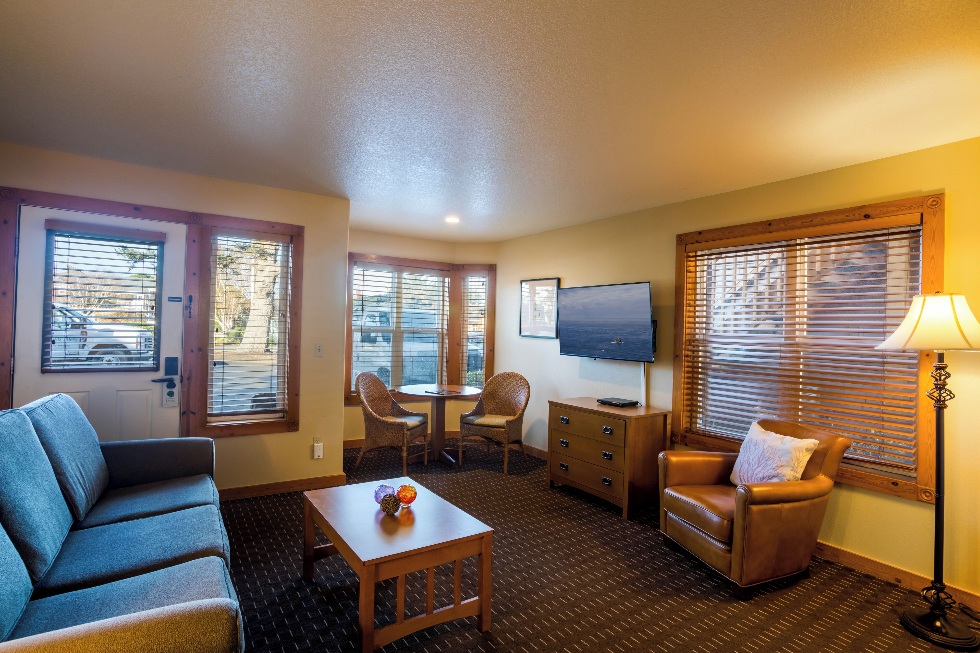 suite, 1 queen bed with sofa bed, kitchenette (1st floor, pet-friendly) | living area | 50-inch flat-screen tv with cable channels, tv, dvd player