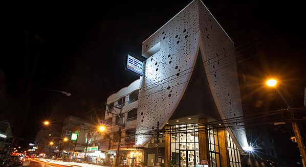 A modern building with a unique perforated facade and large windows. - The Bed Hatyai (Hat Yai)