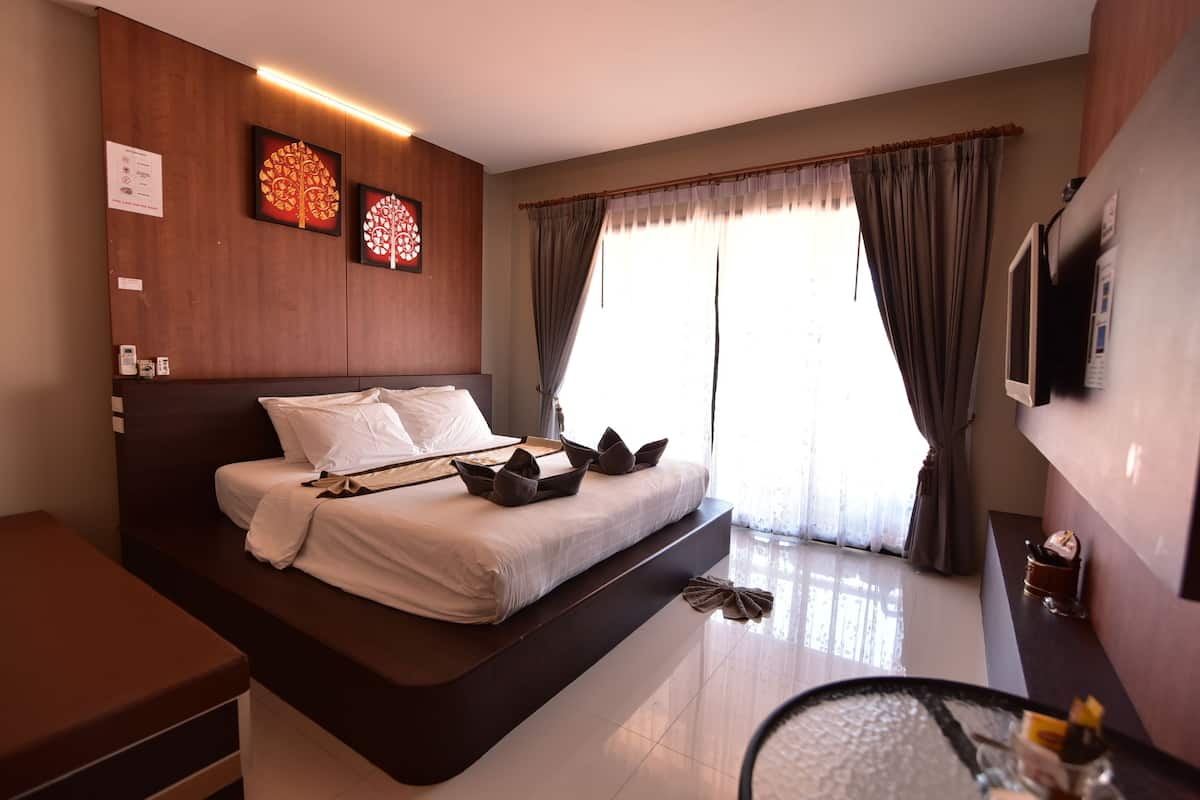 Habitación Deluxe | Caja fuerte, cortinas opacas, wifi gratis y ropa de cama