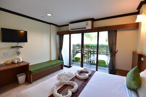 Huone, näköala puutarhaan (Garden View Room) | Tallelokero huoneessa, työpöytä, lisävuoteet, ilmainen Wi-Fi