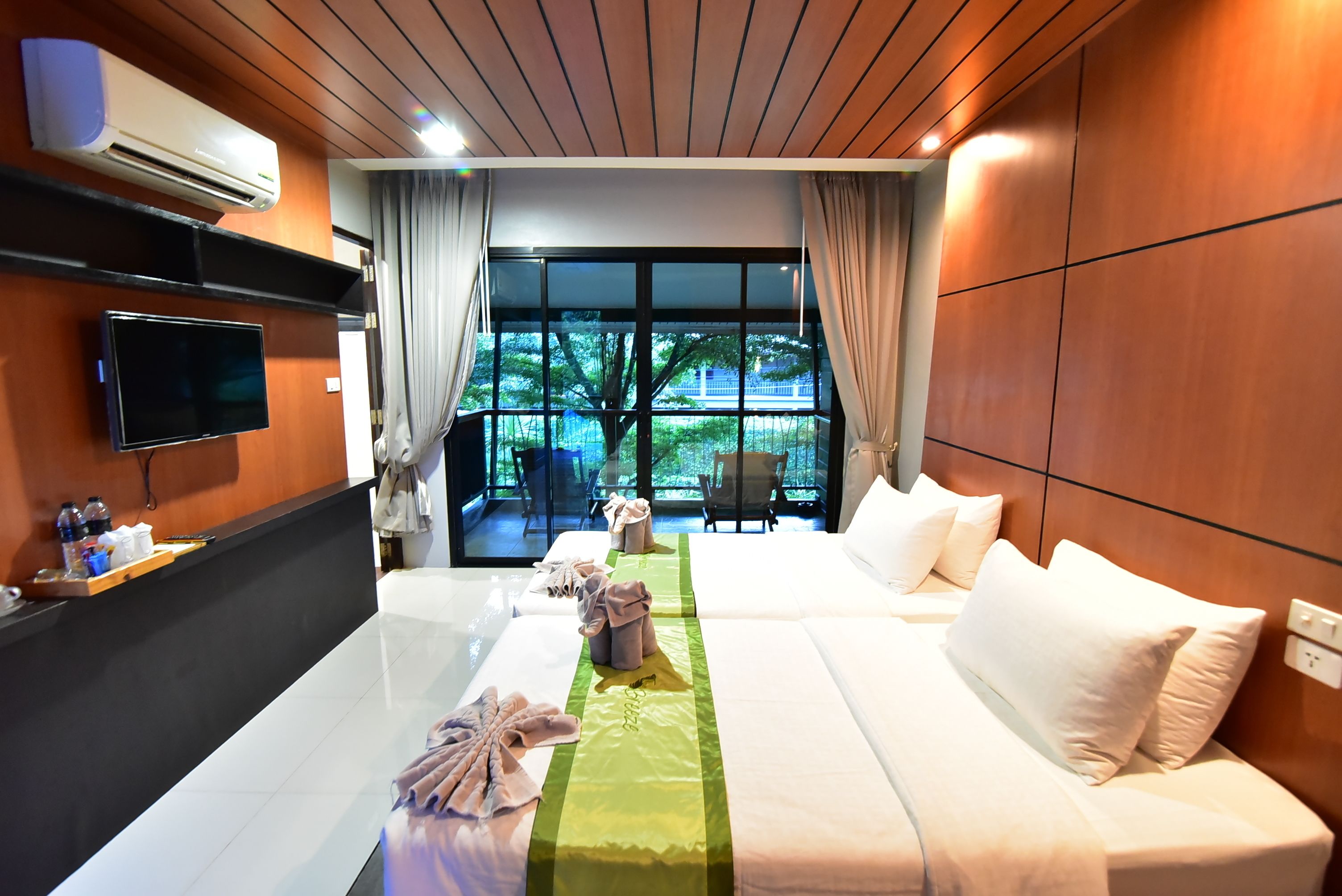 deluxe twin room garden view with balcony | in-room safe, blackout curtains, cots/infant beds, rollaway beds