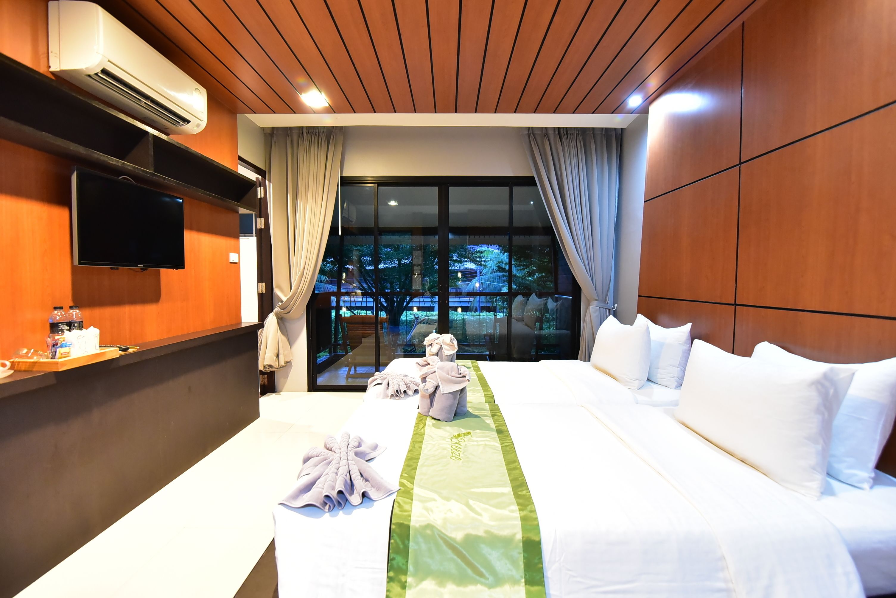 deluxe twin room garden view with balcony | in-room safe, blackout curtains, cots/infant beds, rollaway beds
